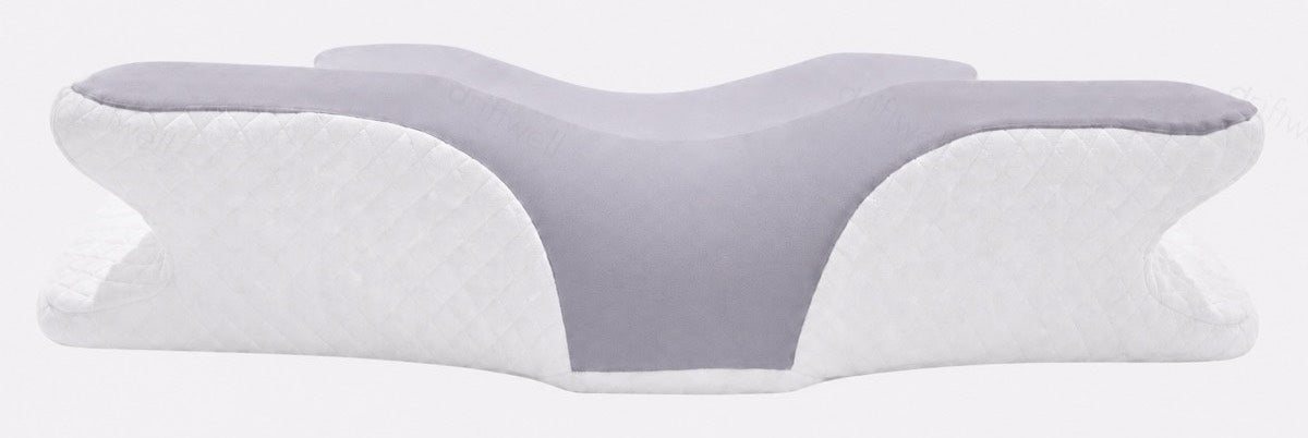 The pillow with its taller edge presented, seen straight on